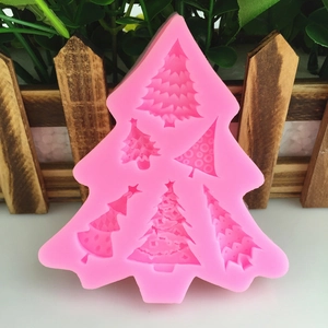 Pink Christmas tree silicone mold with six unique textured designs for DIY baking and crafts