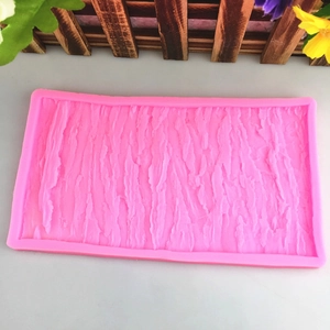 Pink silicone fondant mold with realistic tree bark texture for cake edge decoration