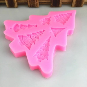 Pink silicone mold featuring six different Christmas tree designs for DIY cake and chocolate