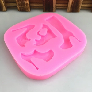 Pink silicone mold with four high heel shapes for DIY cake decorating and chocolates