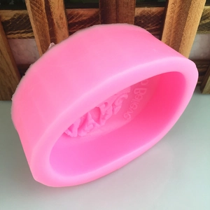 Pink oval silicone mold with Believe text for DIY handmade soap and candles