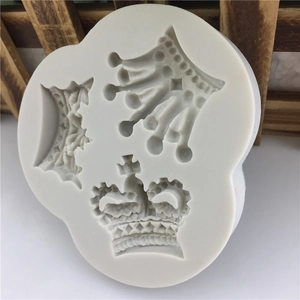 White silicone fondant mold with three different European phoenix crown designs for baking