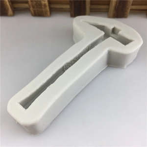 Macro shot of a hammer shaped white silicone mold for DIY resin or chocolate making