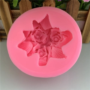 Pink silicone mold featuring three large 3D rose flower shapes for cake and candle DIY