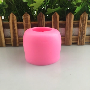 Pink mangosteen silicone mousse mold for DIY cake making on white tabletop background