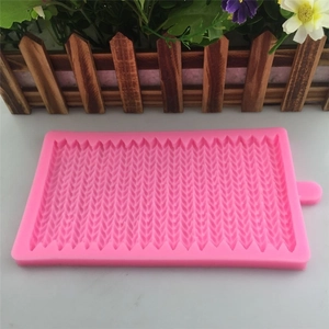 Pink silicone mold featuring detailed knitted texture for fondant cake border decoration