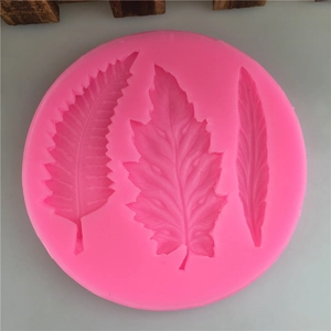 Pink circular silicone mold with three leaf patterns for fondant and chocolate decoration