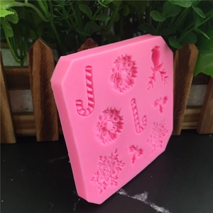 Pink silicone Christmas mold with snowflakes and candy canes for fondant and cake decor
