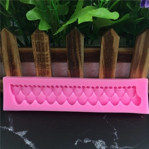 Pink silicone wave border mold for fondant cake decorating and DIY craft projects