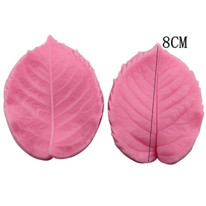 Detail showing 8cm pink silicone leaf mold with intricate vein textures for fondant cake DIY