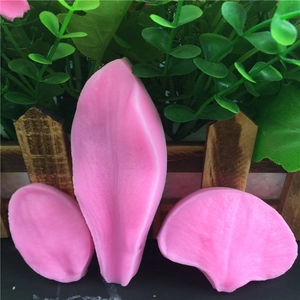 Pink silicone leaf petal fondant molds set with realistic texture on green background