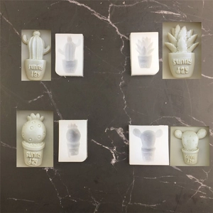 Detail of four cactus-shaped silicone molds for DIY fondant and chocolate cake decoration