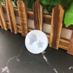 Silicone mold with seashell and starfish shapes for DIY ocean themed resin and fondant cakes