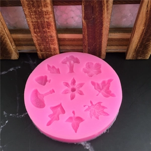 Pink silicone mold with maple leaf and floral patterns for fondant and handmade soaps