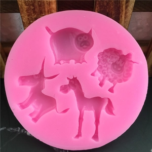 Pink silicone mold featuring cute pig, sheep, and horse shapes for fondant cake decorating