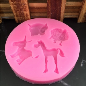 Pink round silicone mold featuring pig sheep horse and donkey animal shapes for fondant cakes