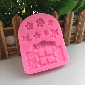 Pink silicone mold featuring floral window and heart patterns for cake decorating and DIY