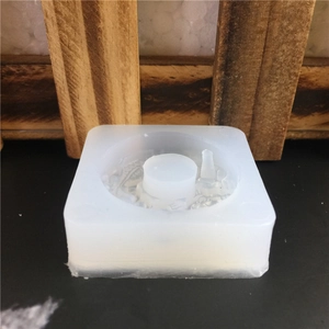 Translucent square silicone mold with intricate circular relief pattern for DIY resin or cake