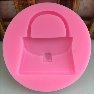 Pink round silicone mold for handmade fondant cake with classic handbag shaped cavity