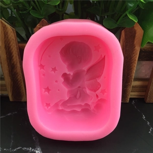 Pink silicone mold featuring a praying angel and stars for fondant and cake decorating