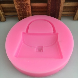 Pink silicone mold featuring a classic handbag shape for fondant cake decorating and DIY crafts