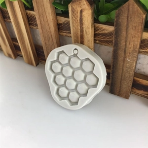 3D honeycomb silicone mold for DIY soap, chocolate, and resin crafts shown on white table