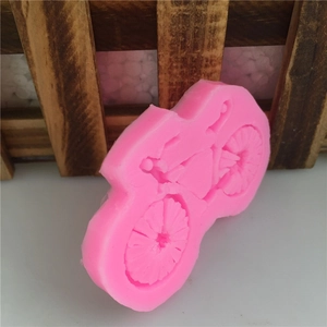 Pink bicycle-shaped silicone mold for DIY fondant cake decorating and handmade soap