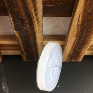 Round white silicone mold with embossed butterfly design for DIY crafts and decorations