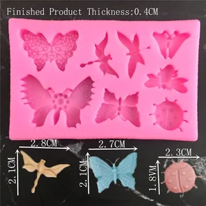 Pink silicone insect mold featuring butterfly and dragonfly shapes for fondant cake decorating