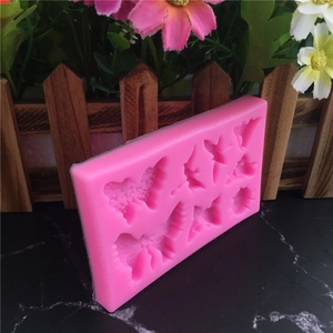 Pink silicone mold with 8 various butterfly shapes for fondant and cake decoration