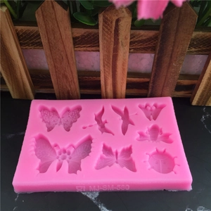 Pink silicone insect mold with butterflies, dragonflies and bees for fondant cake decorating