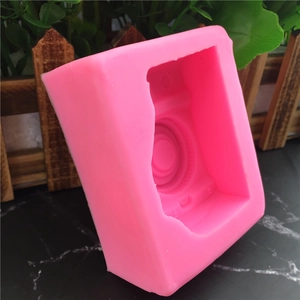 Pink silicone mold with a vintage camera shape for fondant, soap, and cake decorating