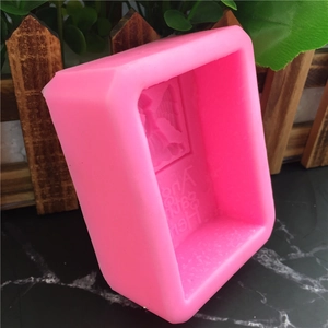 Pink silicone mold featuring Angels Gather Here text and cherub design for cake crafting