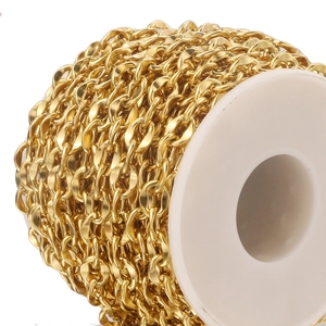 Detail of 7mm gold plated stainless steel lip chain on a white spool for DIY jewelry