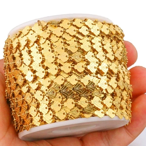 Gold stainless steel shell chain on white spool for jewelry making and DIY crafts