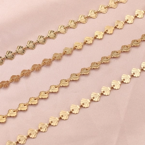 Detailed macro view of champagne gold stainless steel shell link chains for DIY jewelry making