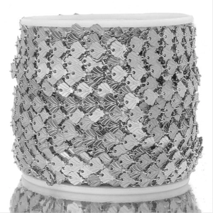 Macro detail of silver shell-shaped stainless steel DIY jewelry chain on a white spool