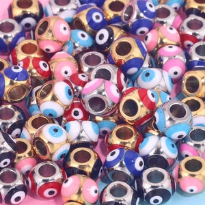 Macro shot of colorful enamel evil eye stainless steel beads for DIY jewelry making