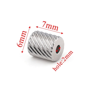 Macro view of 6x7mm stainless steel mesh textured tube bead with 2mm hole for DIY jewelry