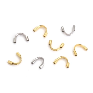 Macro view of gold and silver stainless steel U-shaped wire guards for jewelry making