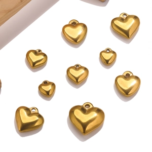 Macro shot of assorted gold stainless steel heart pendants for DIY jewelry making