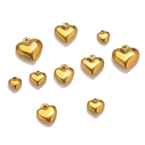 Detailed close-up of polished gold stainless steel heart pendants in various sizes