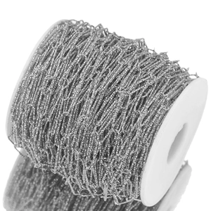 Textured oval link stainless steel chain on white spool for DIY jewelry making