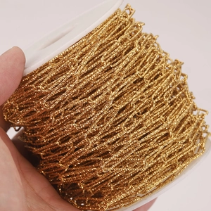 Bulk gold-plated stainless steel oval link chain on a white spool for DIY jewelry making