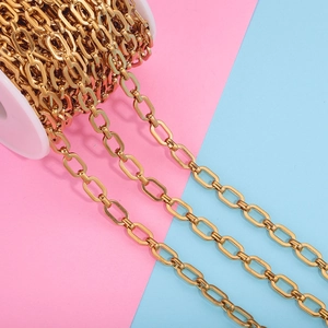 Gepolijste gouden roestvrijstalen platte ovale schakelketting op witte spoel voor DIY sieraden