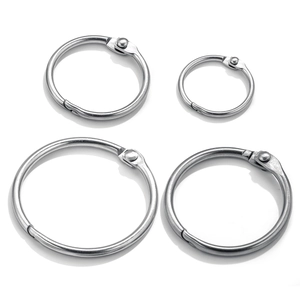 Detailed set of four stainless steel binder rings with various diameter sizes