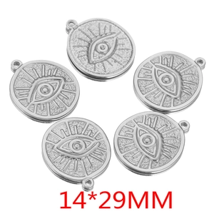 Detailed view of five vintage stainless steel evil eye charms in 14x29mm size