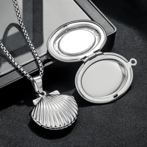 Vintage oval shell locket necklace in stainless steel with elegant ribbed texture and chain