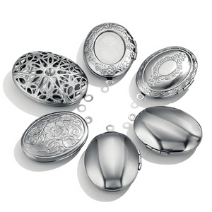 Set of oval stainless steel lockets with vintage floral relief and smooth polished finish