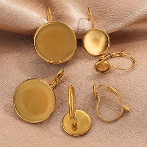 Gold plated stainless steel lever back earring trays on elegant champagne silk fabric